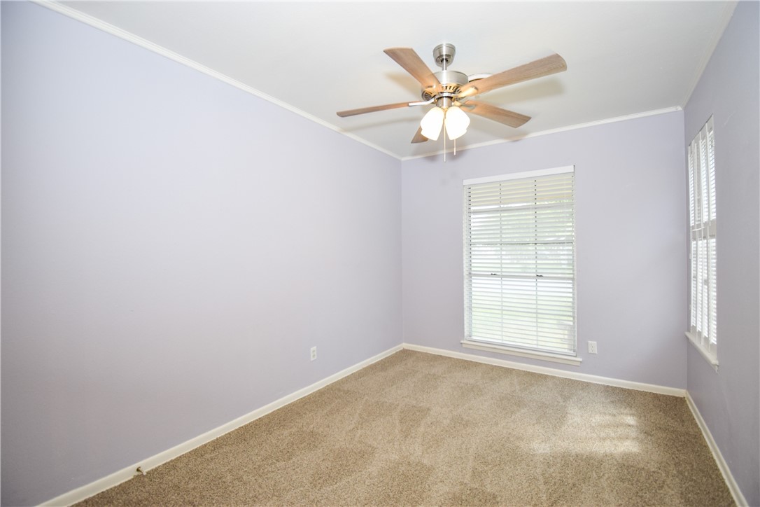 1209 Dallas Street Portland, TX 78374 - Photo 19 of 29 an empty room with windows and fan