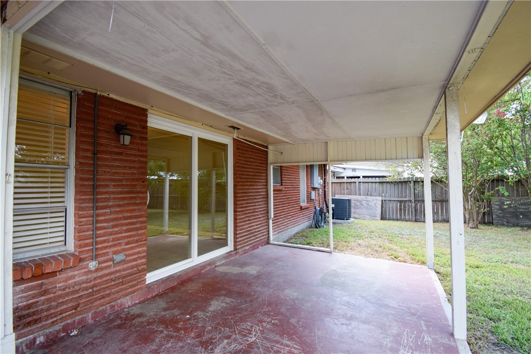 1209 Dallas Street Portland, TX 78374 - Photo 26 of 29 a view of a house with porch and garden