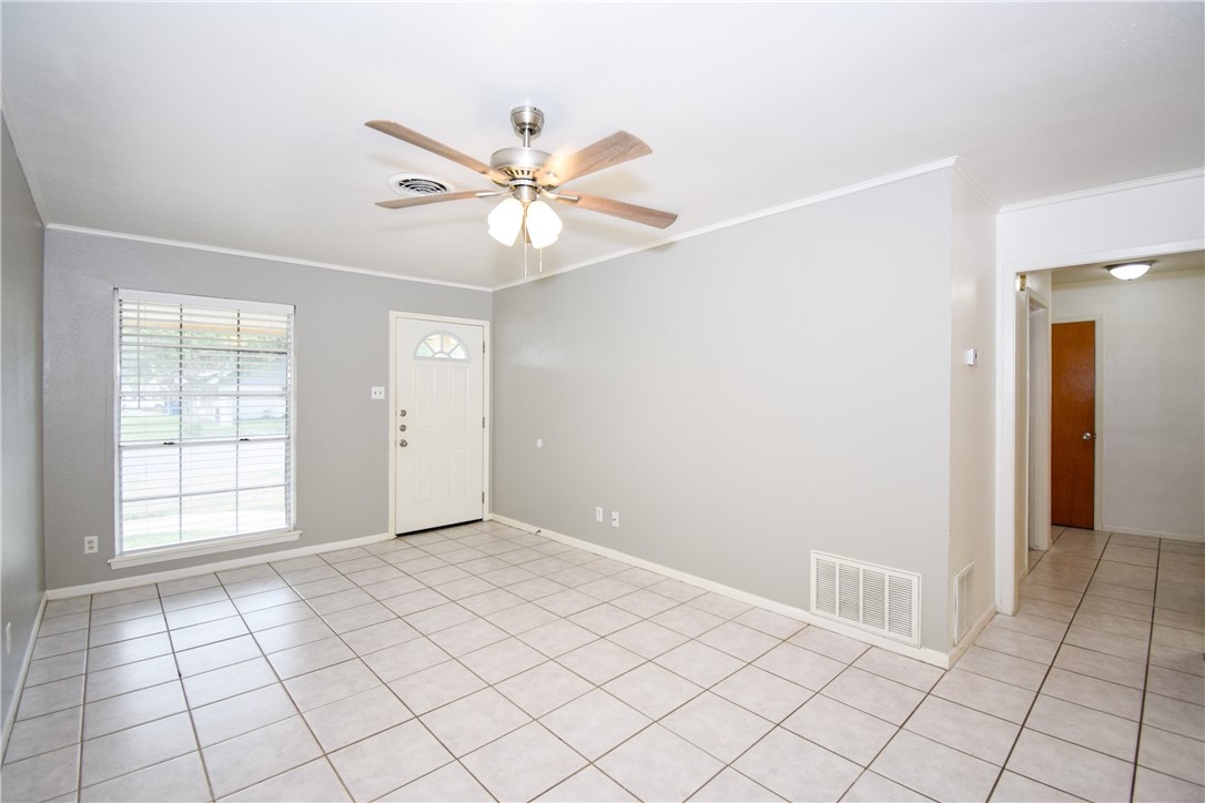 1209 Dallas Street Portland, TX 78374 - Photo 4 of 29 a view of an empty room and window