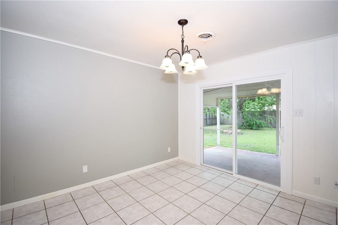 1209 Dallas Street Portland, TX 78374 - Photo 9 of 29 a view of an empty room with a window
