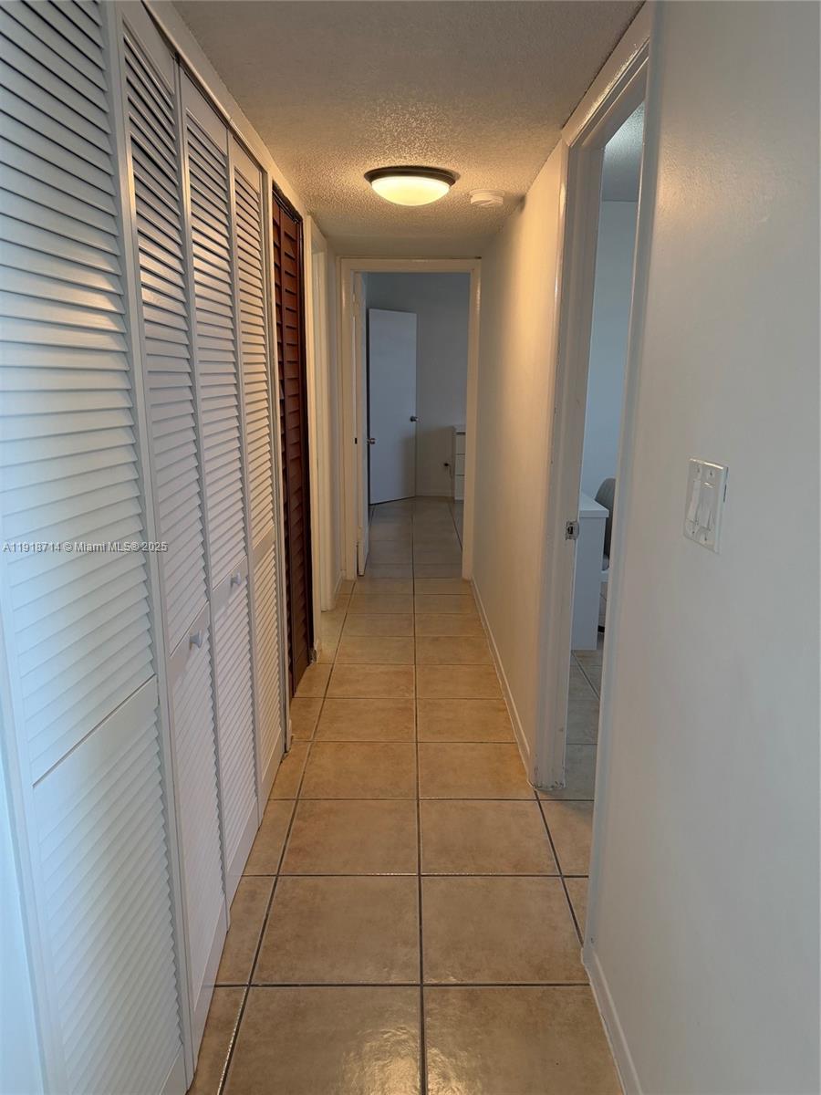 8411 Northwest 8th Street, Unit 405 Miami, FL 33126 - Photo 14 of 23 a view of a hallway