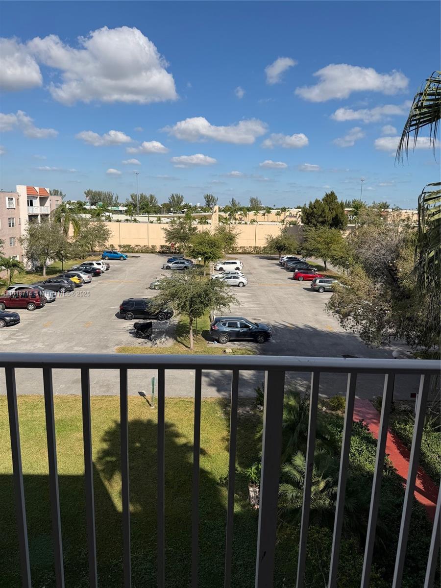 8411 Northwest 8th Street, Unit 405 Miami, FL 33126 - Photo 20 of 23 a view of a balcony with an outdoor seating