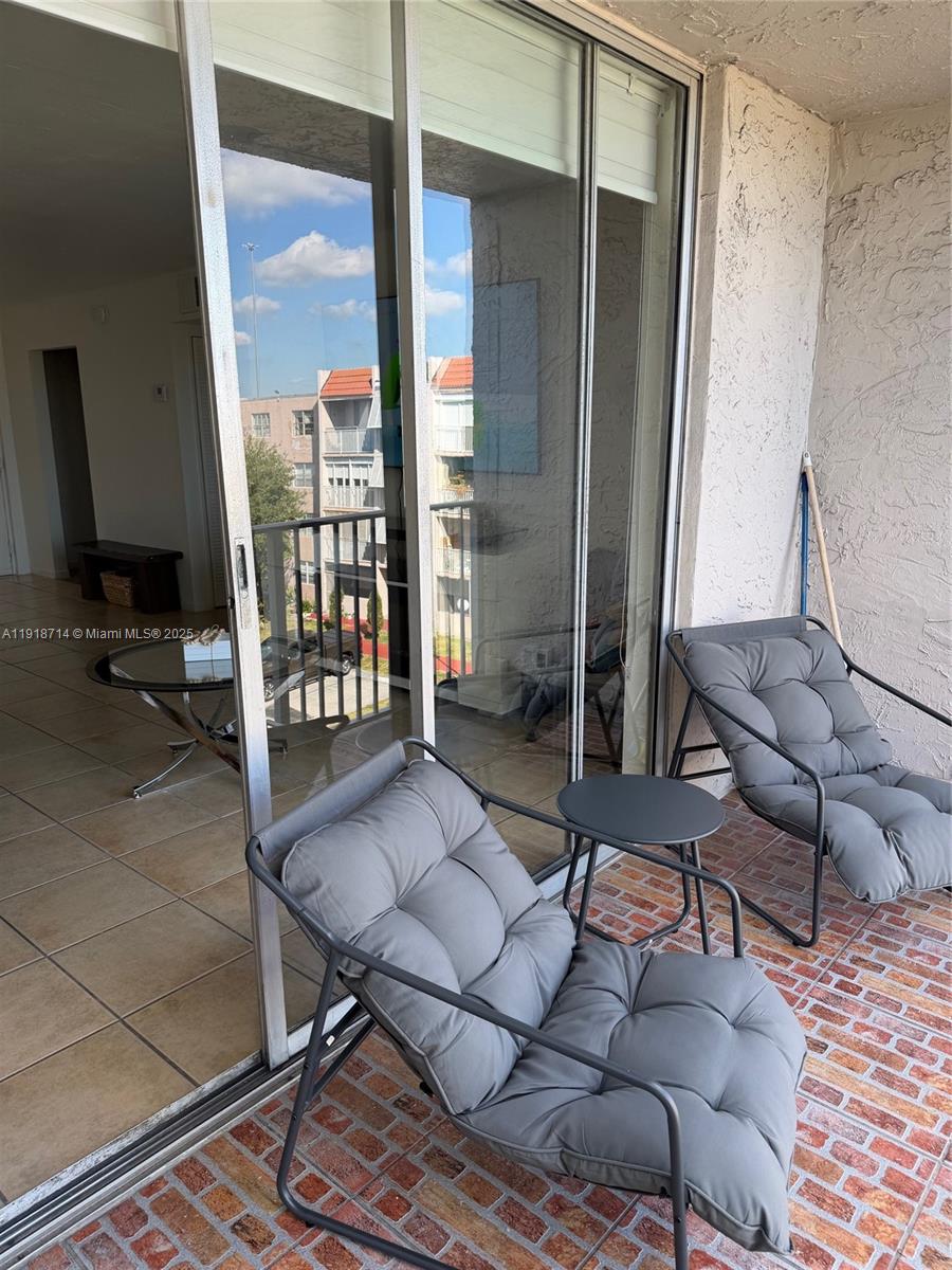 8411 Northwest 8th Street, Unit 405 Miami, FL 33126 - Photo 21 of 23 a outdoor living space with furniture