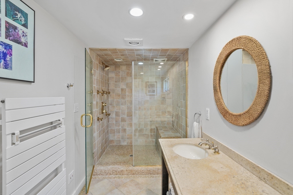 28 Crocker Drive Edgartown, MA 02539 - Photo 11 of 24 a bathroom with a sink a toilet and a shower