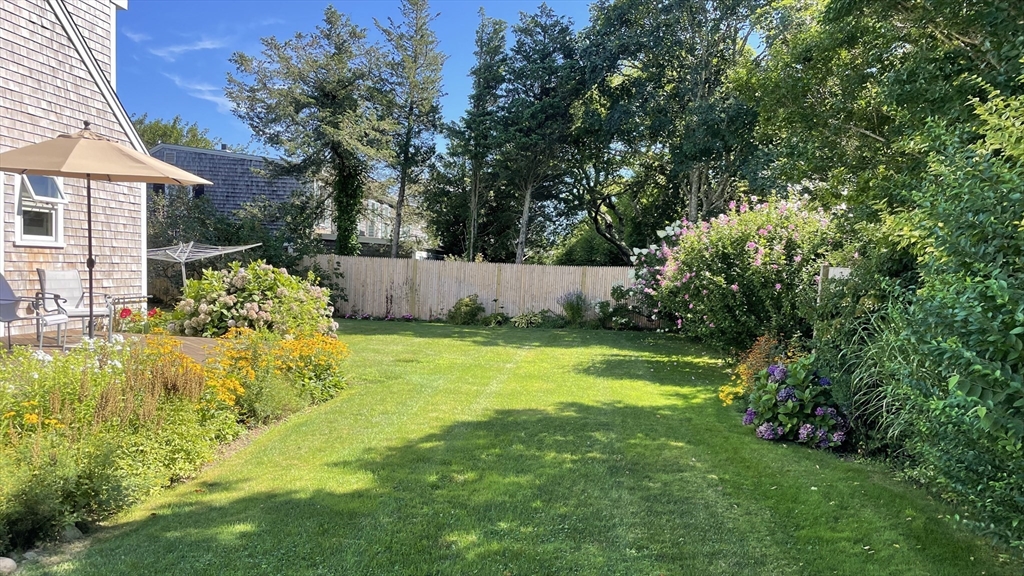 28 Crocker Drive Edgartown, MA 02539 - Photo 14 of 24 a view of a swimming pool with an outdoor space and seating area