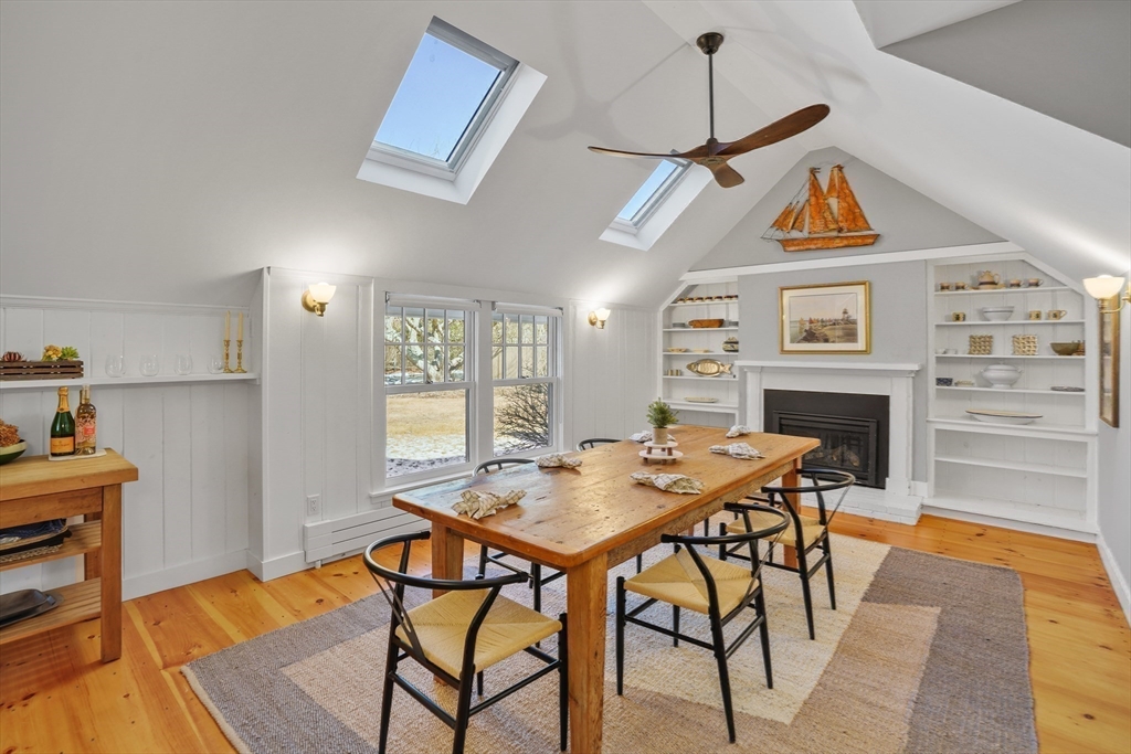 28 Crocker Drive Edgartown, MA 02539 - Photo 5 of 24 a view of a dining room with furniture wooden floor and a chandelier