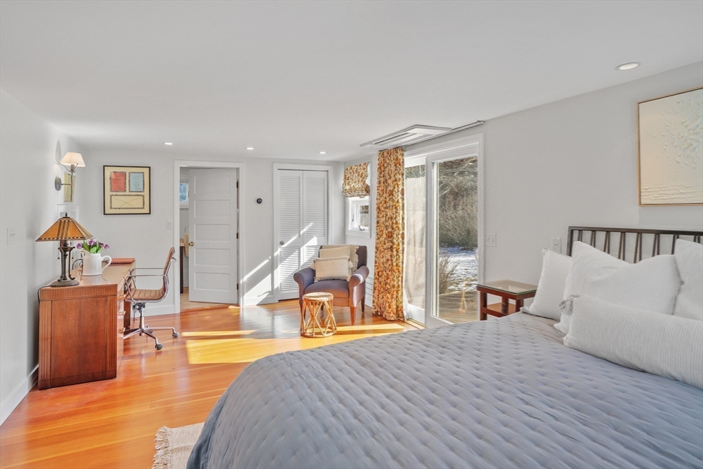 28 Crocker Drive Edgartown, MA 02539 - Photo 10 of 24 a spacious bedroom with a bed and a large window
