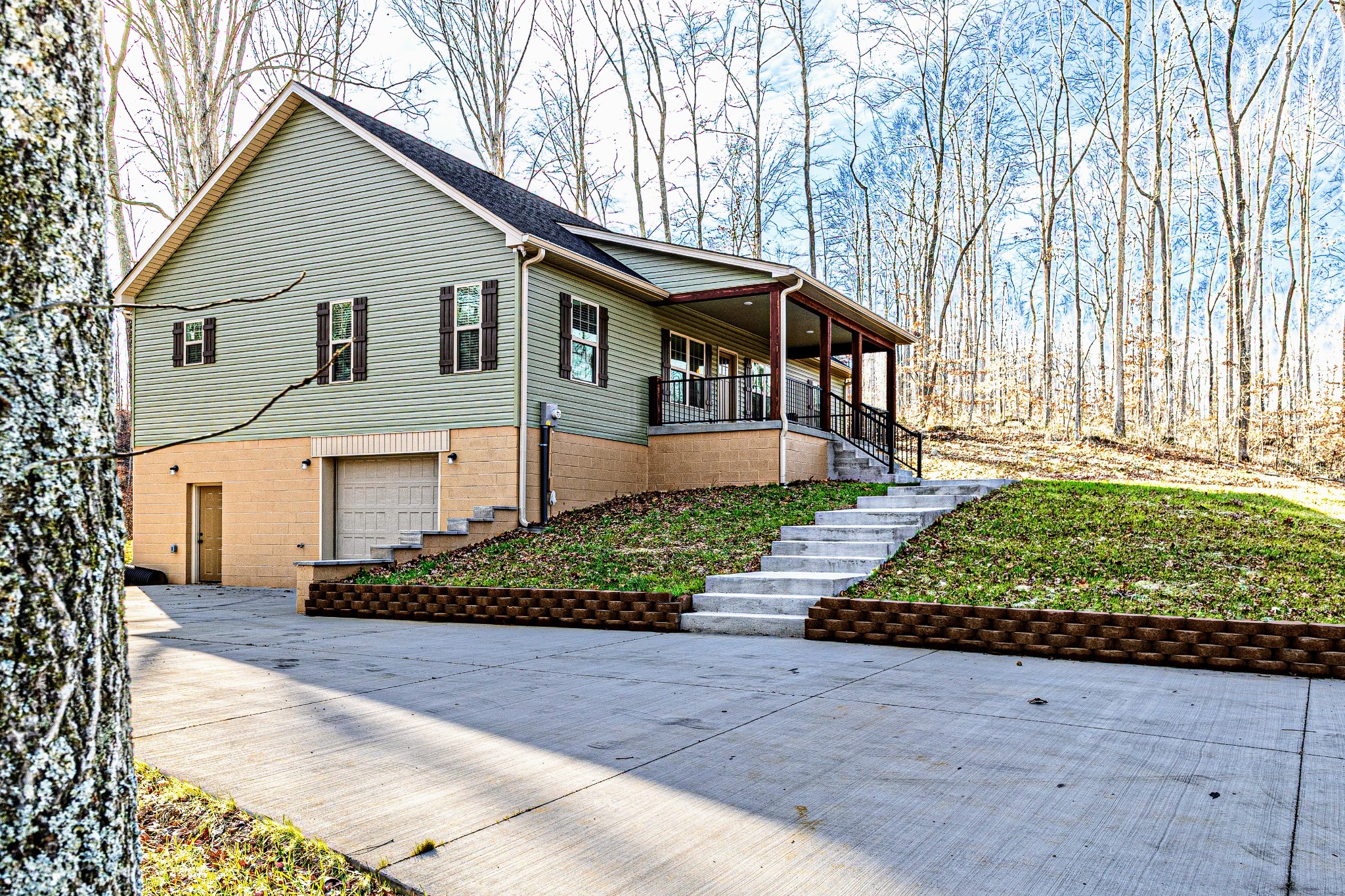 1875 Rocky Hollow Road Erin, TN 37061 - Photo 18 of 31 a front view of a house with a garden