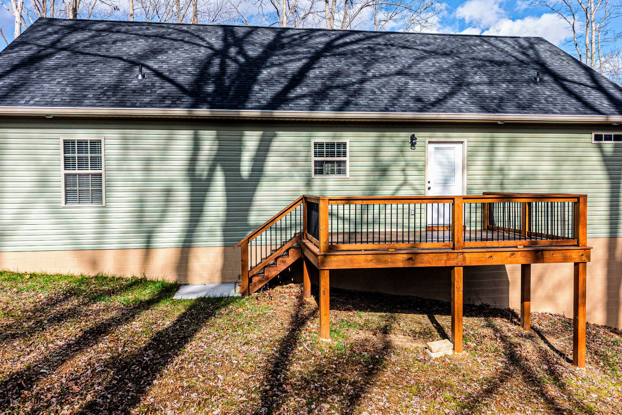 1875 Rocky Hollow Road Erin, TN 37061 - Photo 20 of 31 a wooden bench sitting in front of a house