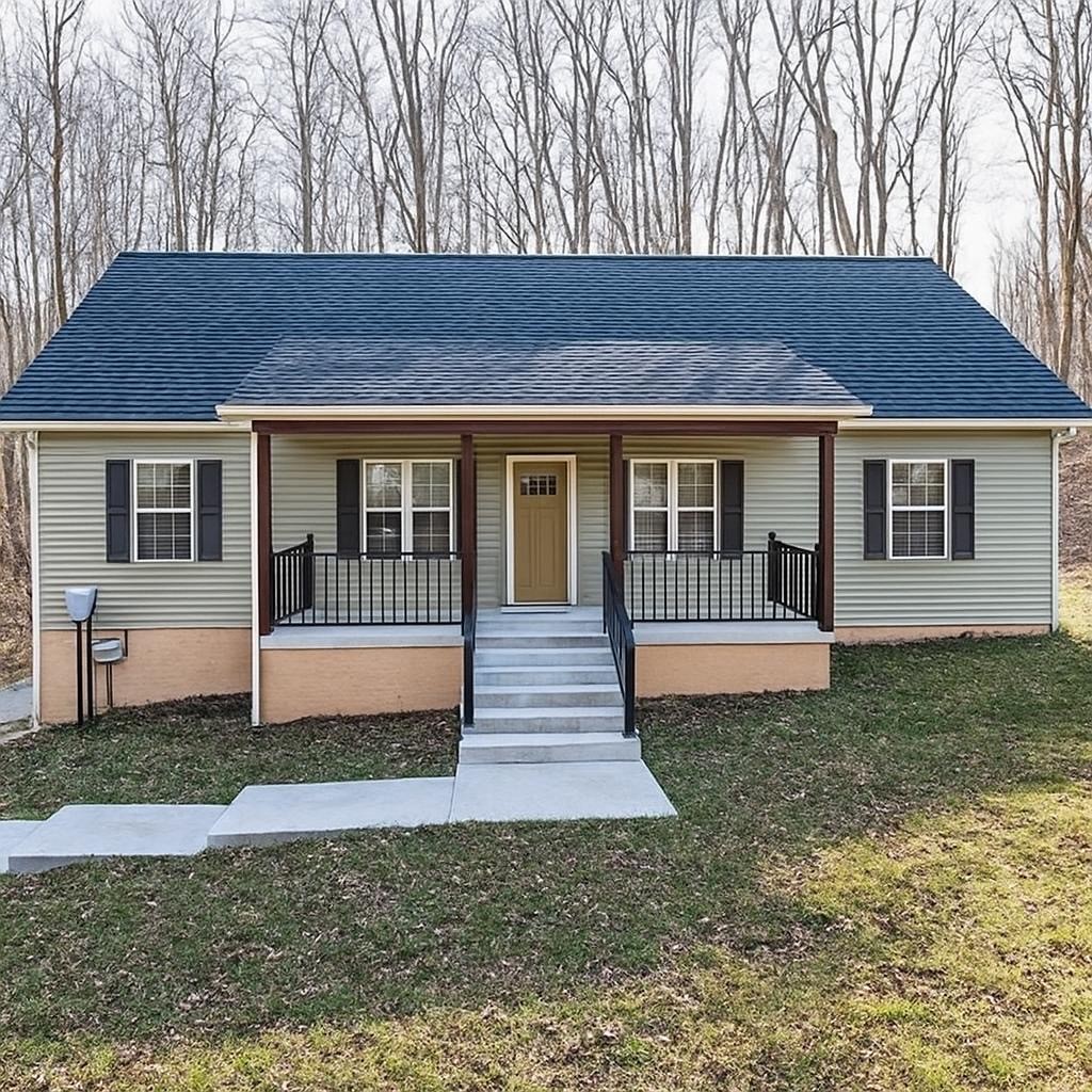1875 Rocky Hollow Road Erin, TN 37061 - Photo 2 of 31 a front view of a house with a yard