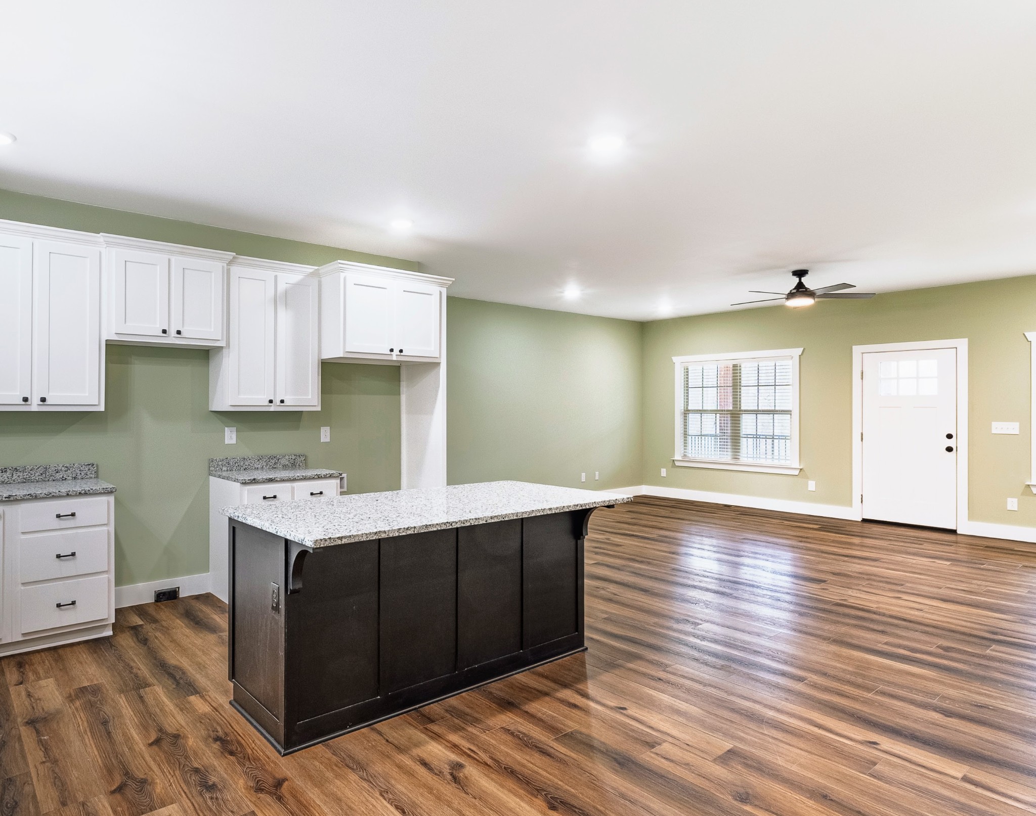 1875 Rocky Hollow Road Erin, TN 37061 - Photo 4 of 31 a kitchen with wooden floors and cabinets