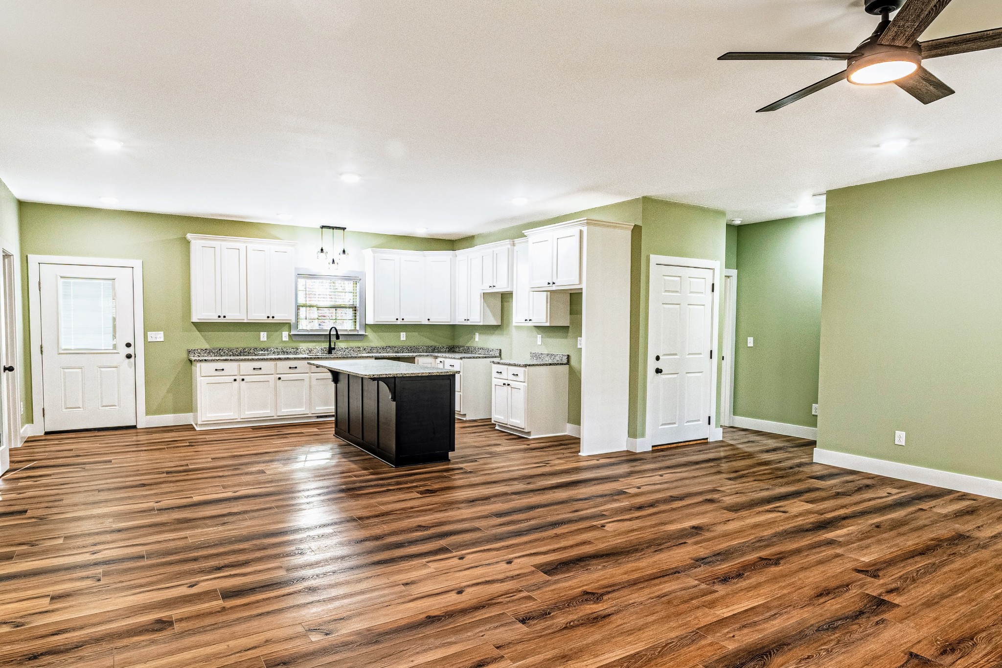 1875 Rocky Hollow Road Erin, TN 37061 - Photo 5 of 31 a large kitchen with kitchen island a sink stainless steel appliances and cabinets