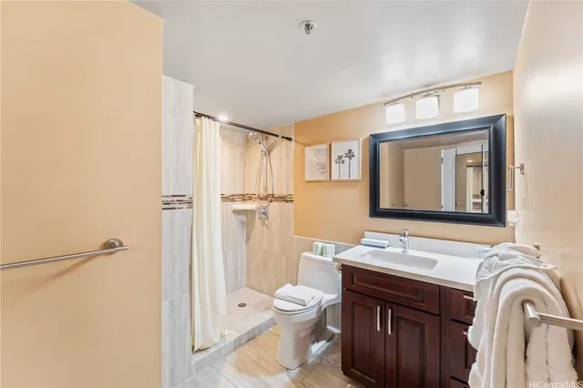 a bathroom with a toilet a sink and a mirror