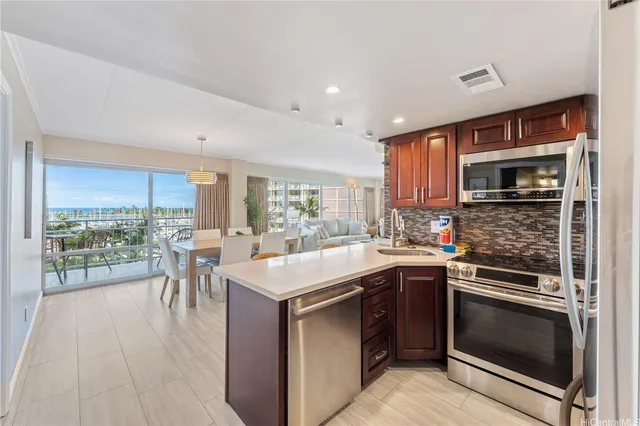 a kitchen with a sink stove and cabinets