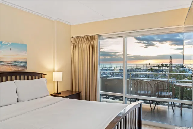 a bedroom with a bed and a night stand