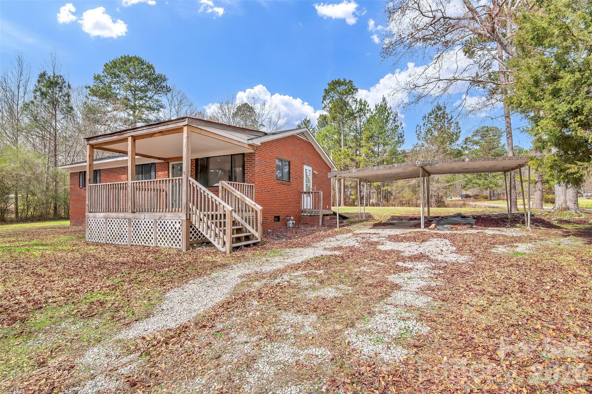 3489 State Rd S-29-582 Lancaster, SC 29720 - Photo 1 of 19 a view of a house with a yard