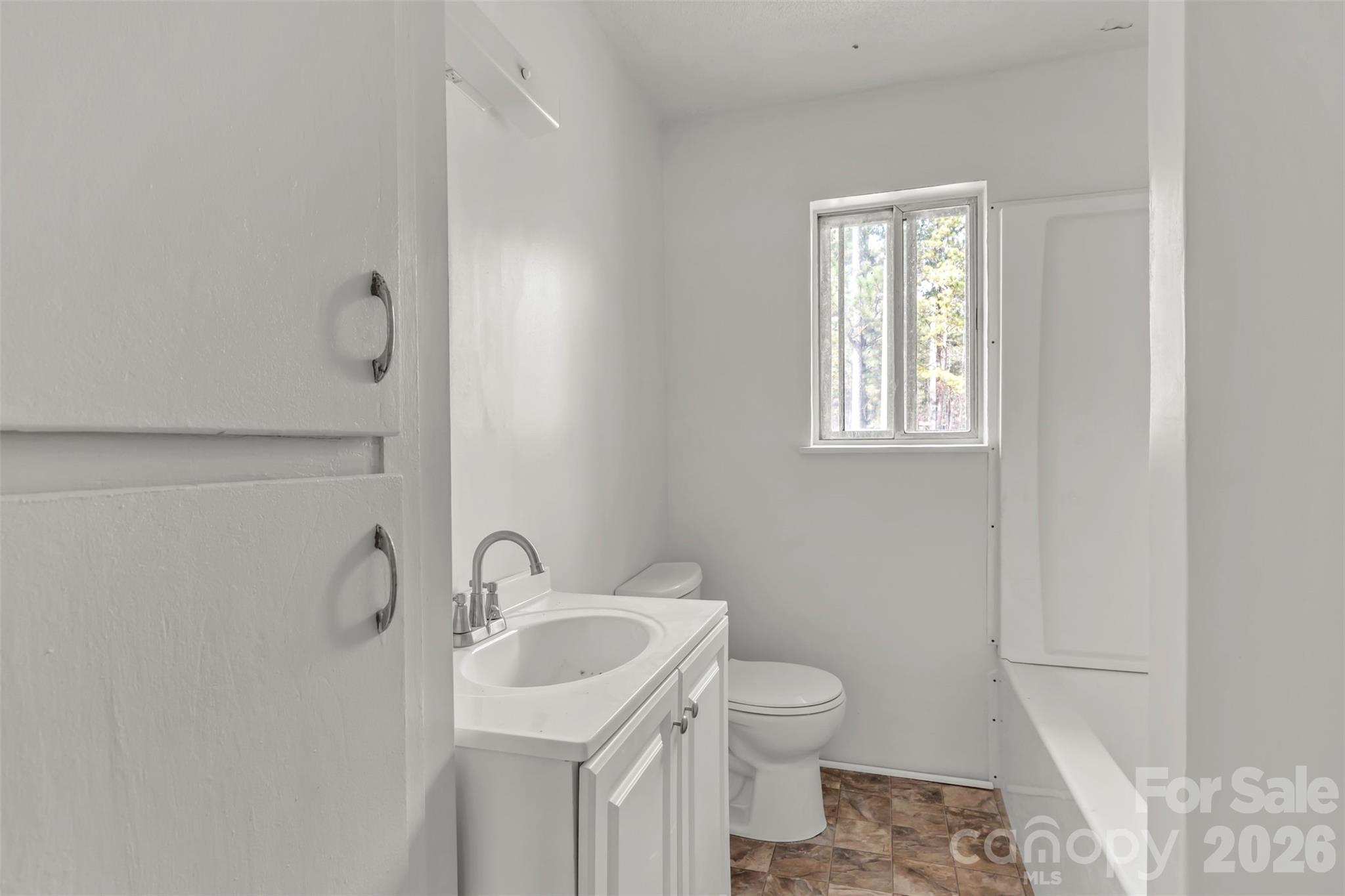 3489 State Rd S-29-582 Lancaster, SC 29720 - Photo 13 of 19 a bathroom with a sink toilet and vanity