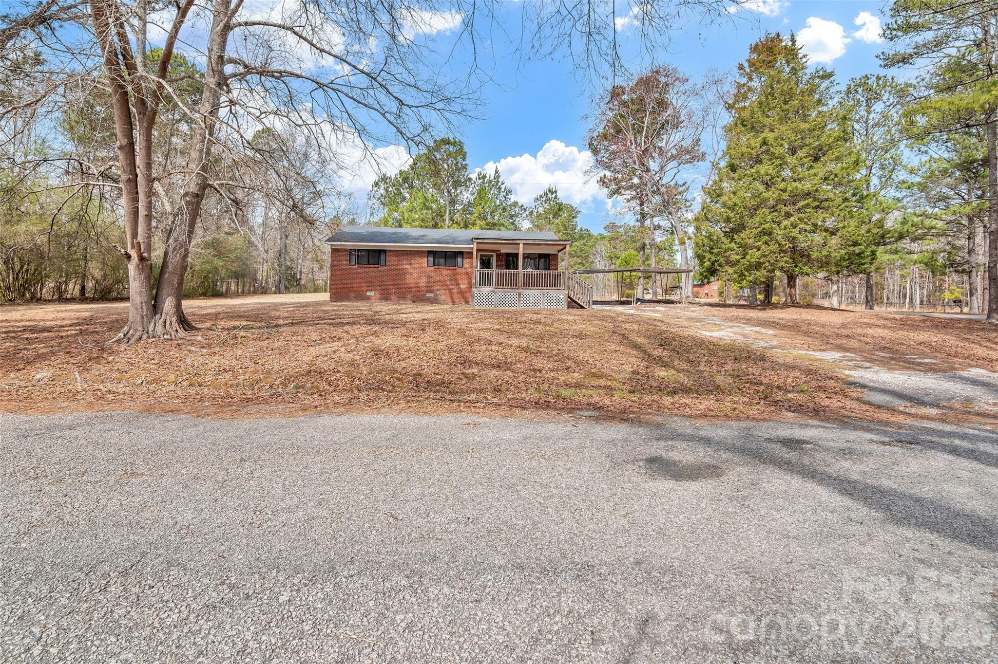 3489 State Rd S-29-582 Lancaster, SC 29720 - Photo 2 of 19 a view of a house with a yard and garage
