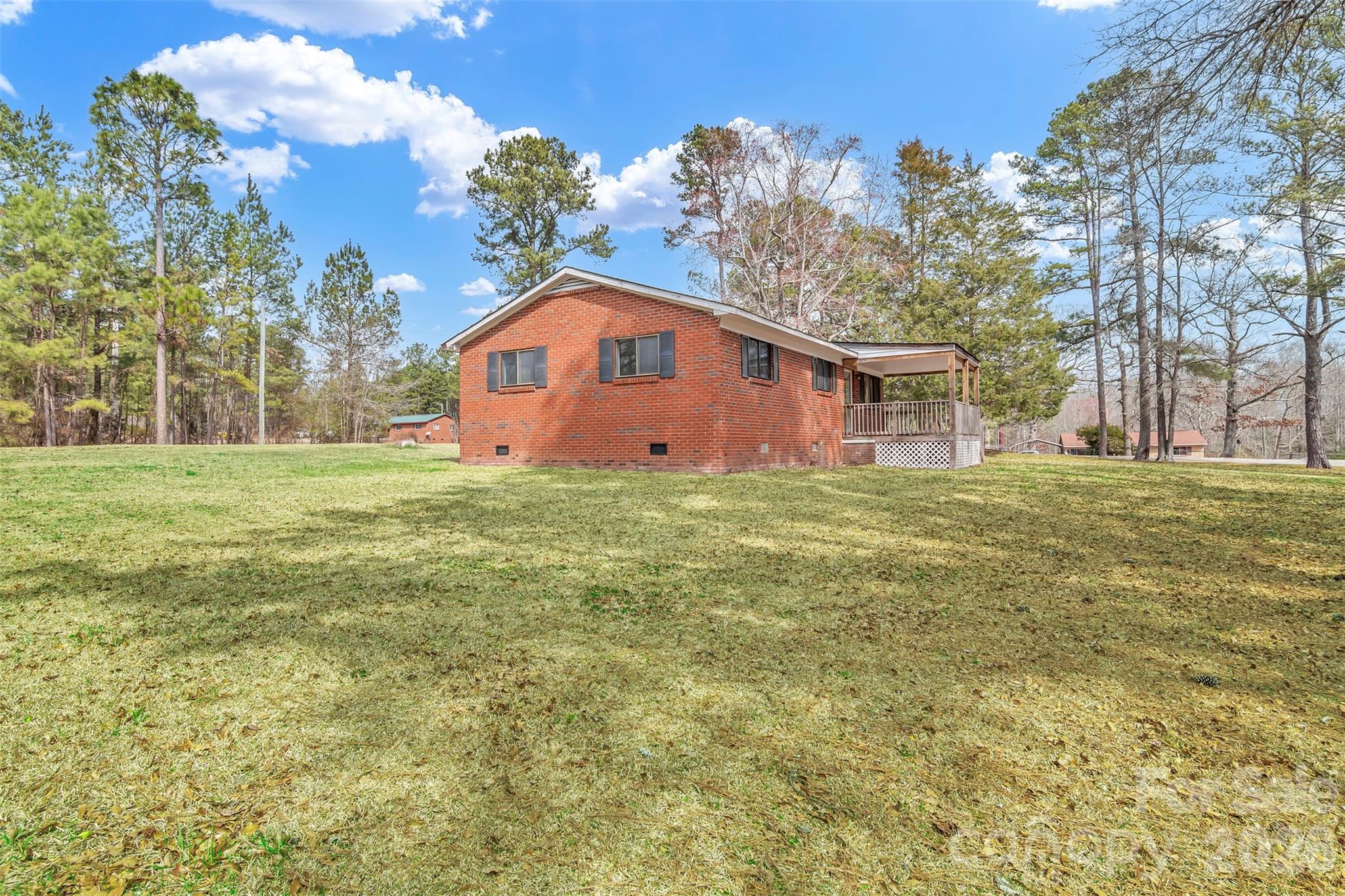 3489 State Rd S-29-582 Lancaster, SC 29720 - Photo 8 of 19 a large tree in front of a house with a yard