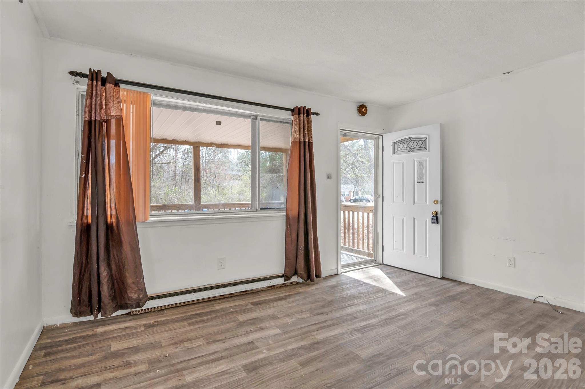 3489 State Rd S-29-582 Lancaster, SC 29720 - Photo 10 of 19 wooden floor in an empty room with a window
