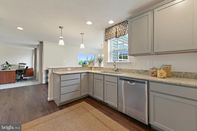 a kitchen with sink cabinets and window