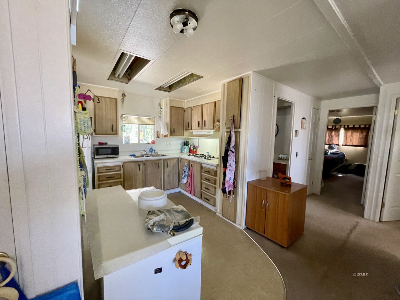5237 Nolina Avenue Ridgecrest, CA 93555 - Photo 8 of 27 a kitchen with stainless steel appliances granite countertop a sink stove and refrigerator