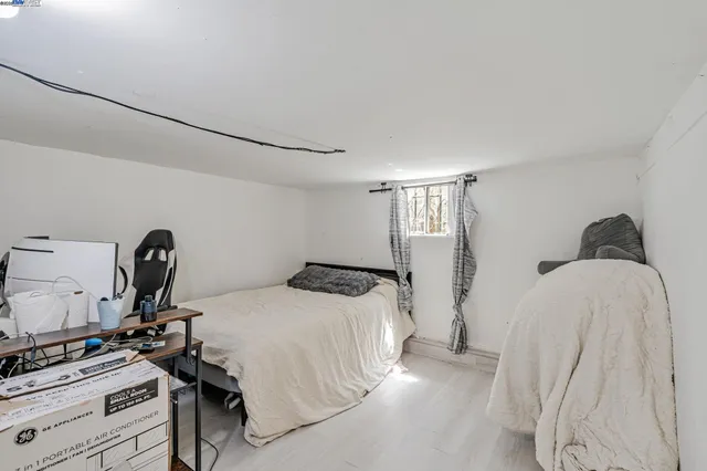 a bedroom with a bed and a table in it