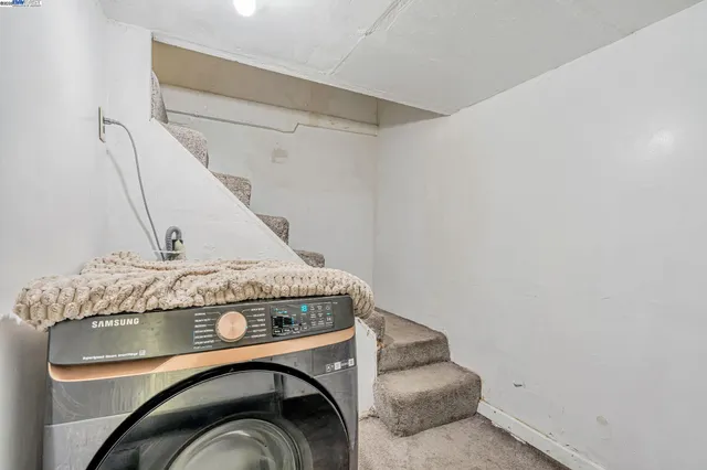 a utility room with washer and dryer