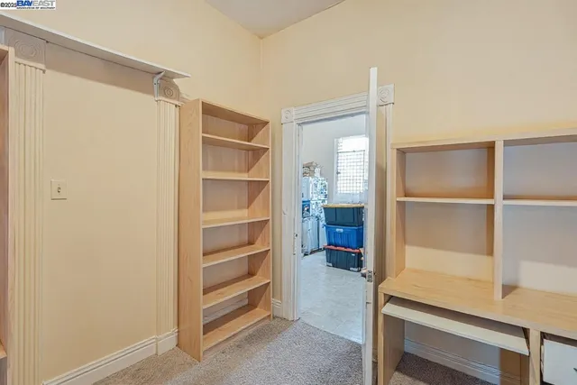 a view of closet area with empty racks
