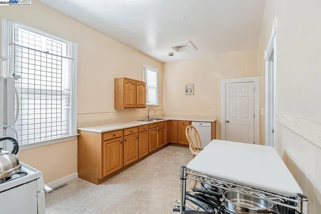 a spacious bathroom with a double vanity sink a mirror and a bathtub