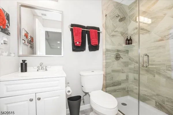 a bathroom with a toilet sink and shower
