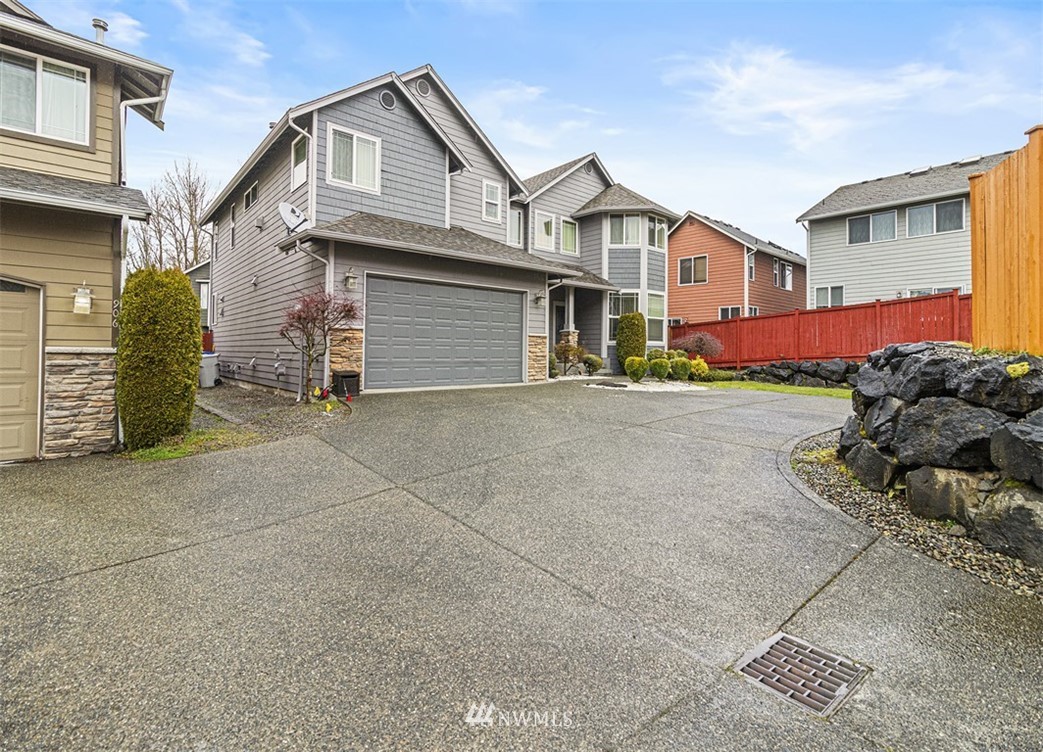 910 South 48th Street Renton, WA 98055 - Photo 2 of 30 a view of a house with a street
