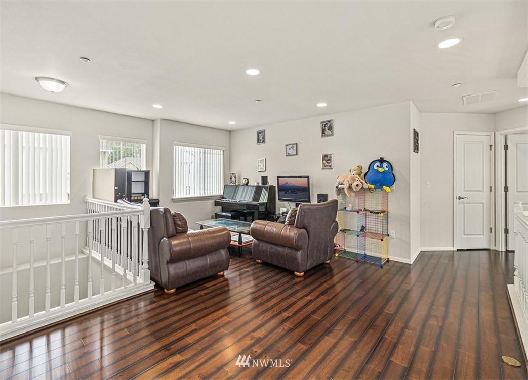 910 South 48th Street Renton, WA 98055 - Photo 15 of 30 a living room with furniture and a wooden floor