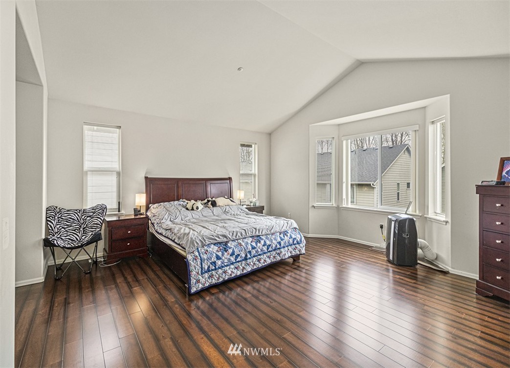 910 South 48th Street Renton, WA 98055 - Photo 19 of 30 a bedroom with a bed lamps and window