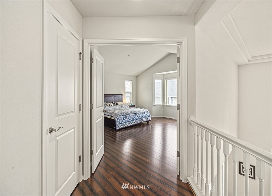 910 South 48th Street Renton, WA 98055 - Photo 20 of 30 a view of a hallway with wooden floor windows and a livingroom