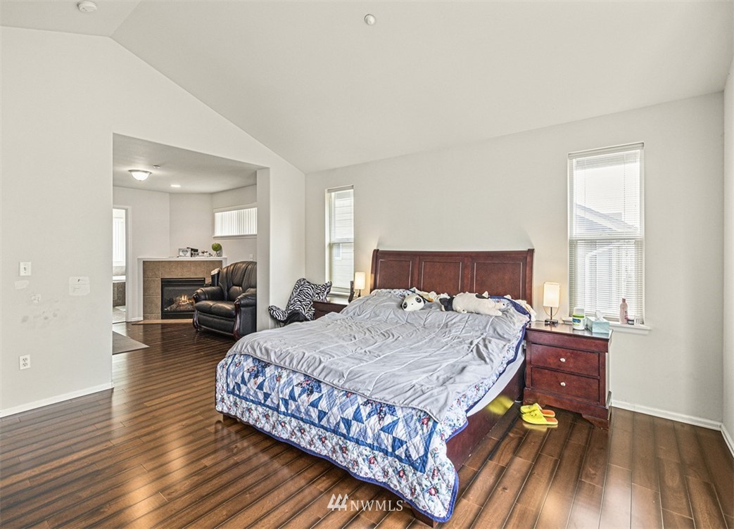 910 South 48th Street Renton, WA 98055 - Photo 21 of 30 a bedroom with a bed and wooden floor