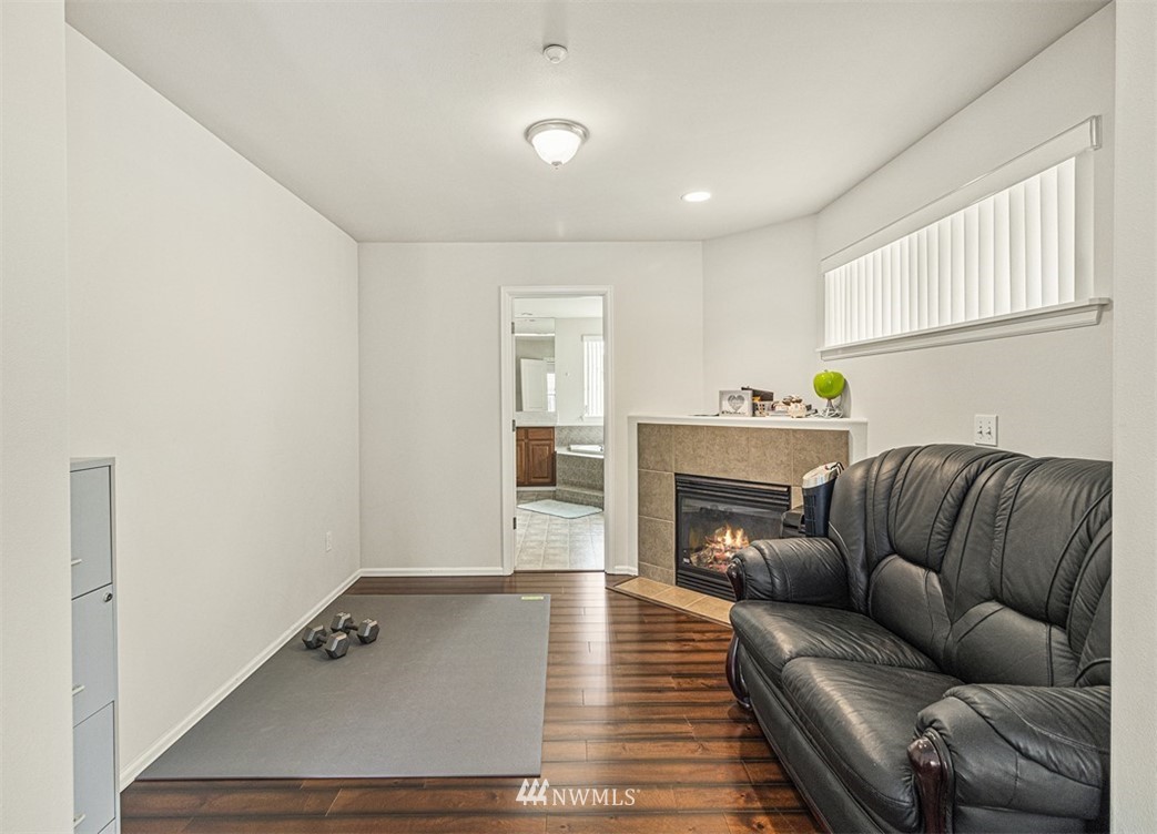 910 South 48th Street Renton, WA 98055 - Photo 23 of 30 a living room with furniture and a fireplace