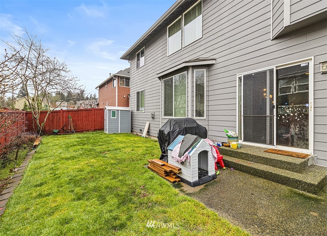 910 South 48th Street Renton, WA 98055 - Photo 28 of 30 a view of backyard with small play house and slide