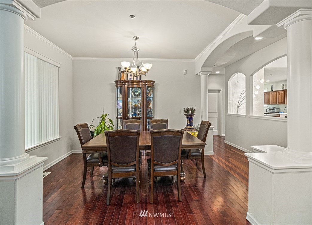910 South 48th Street Renton, WA 98055 - Photo 5 of 30 a view of a dining room with furniture a chandelier and wooden floor