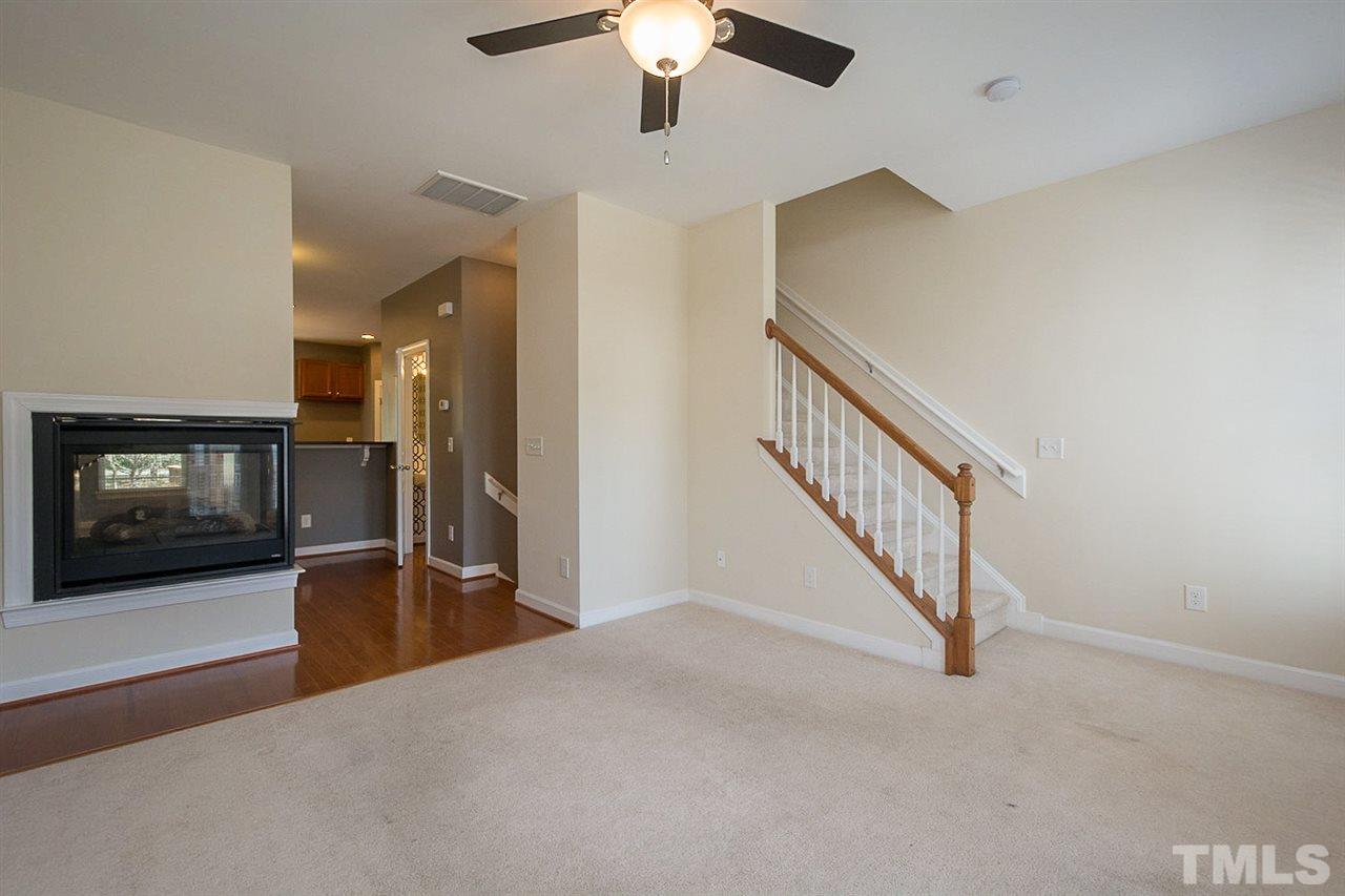 8016 Sycamore Hill Lane Raleigh, NC 27612 - Photo 2 of 19 a view of a livingroom with a fireplace