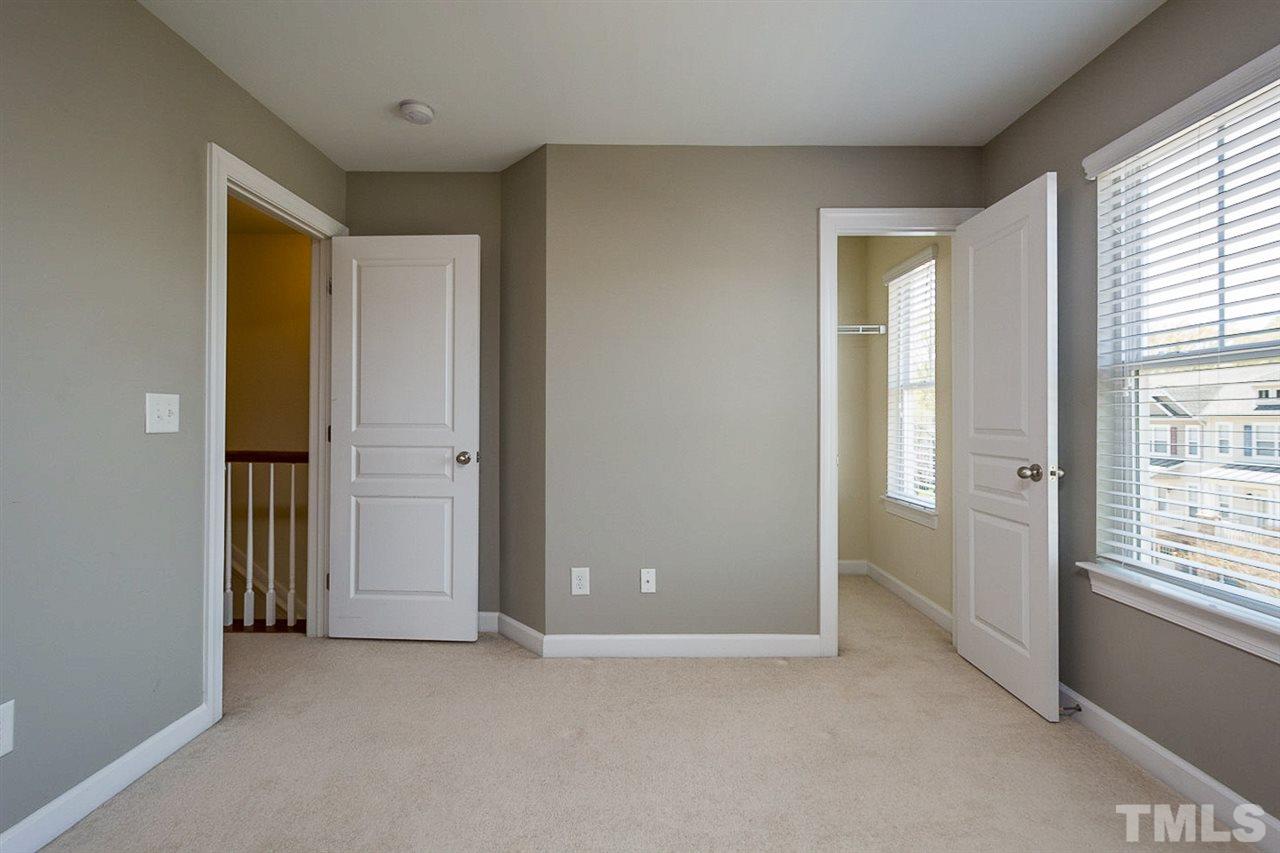 8016 Sycamore Hill Lane Raleigh, NC 27612 - Photo 12 of 19 an empty room with windows and closet