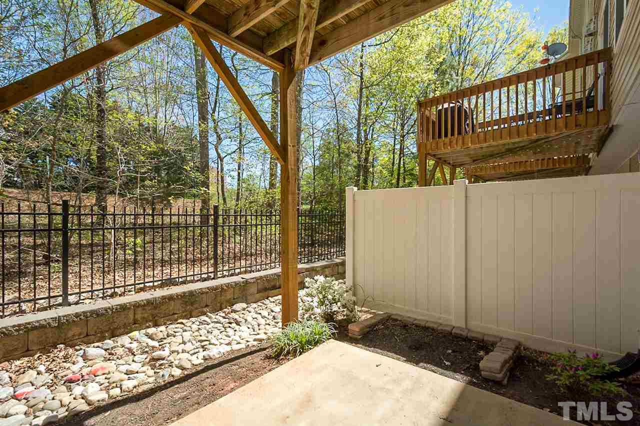 8016 Sycamore Hill Lane Raleigh, NC 27612 - Photo 19 of 19 a view of staircase with wooden fence