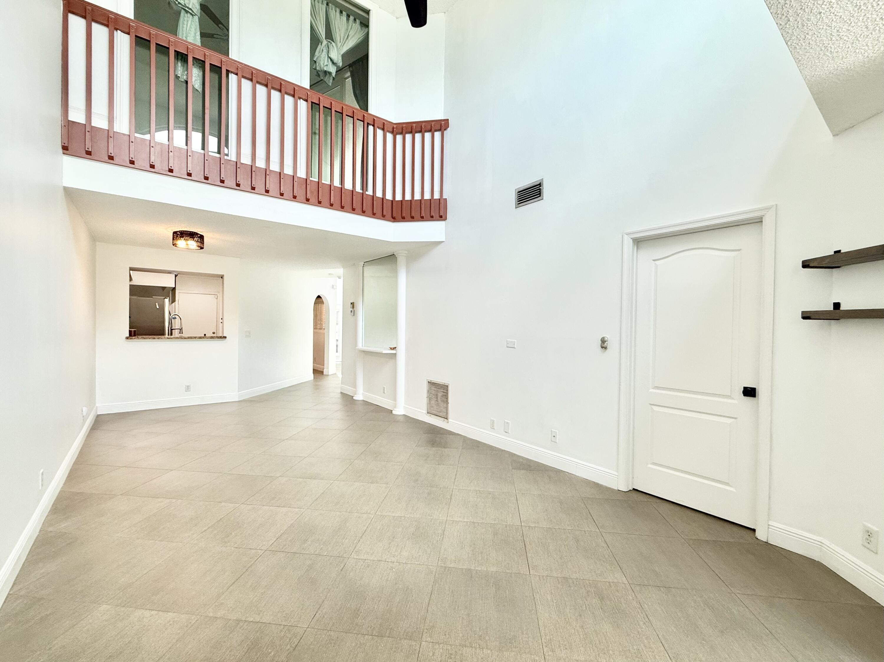9190 Boca Gardens Parkway, Unit B Boca Raton, FL 33496 - Photo 3 of 35 a view of an entryway with a staircase