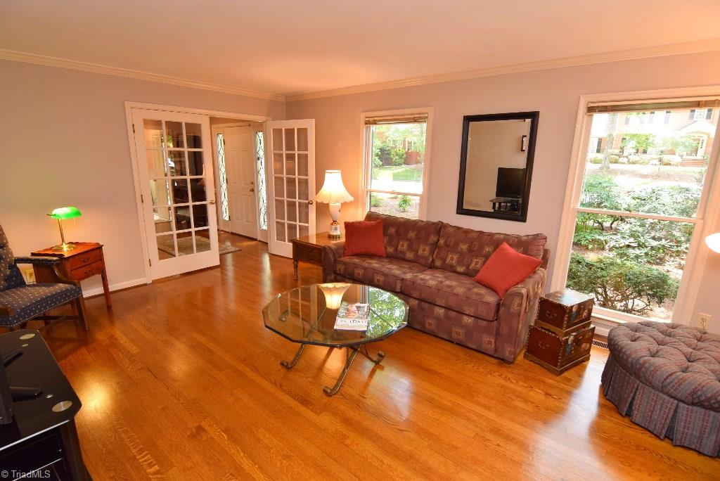 1902 Milan Road Greensboro, NC 27410 - Photo 11 of 30 Large living room with French glass doors and floor to ceiling widows.