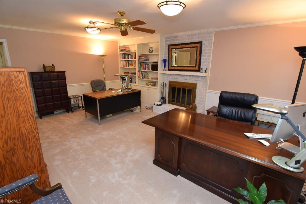 1902 Milan Road Greensboro, NC 27410 - Photo 13 of 30 Spacious den with fireplace and built in bookcases