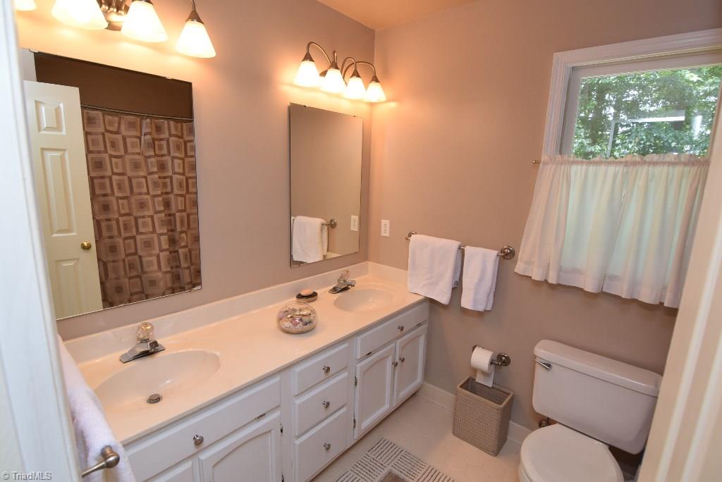 1902 Milan Road Greensboro, NC 27410 - Photo 25 of 30 Guest bathroom offers dual vanities