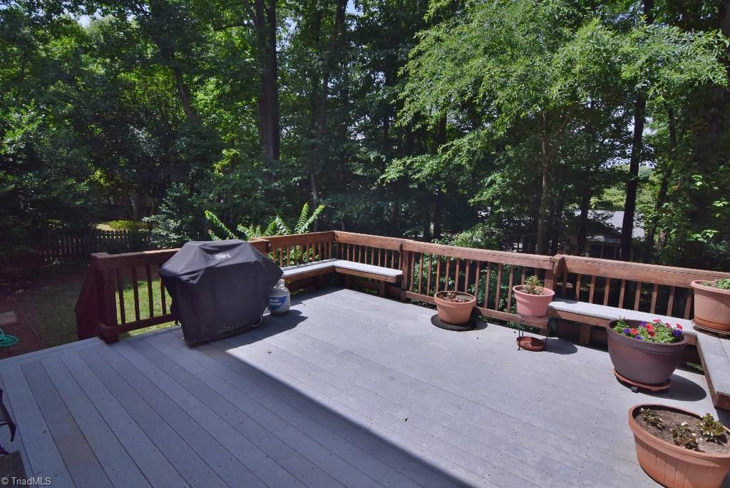 1902 Milan Road Greensboro, NC 27410 - Photo 27 of 30 Large deck overlooks private, partially wooded backyard