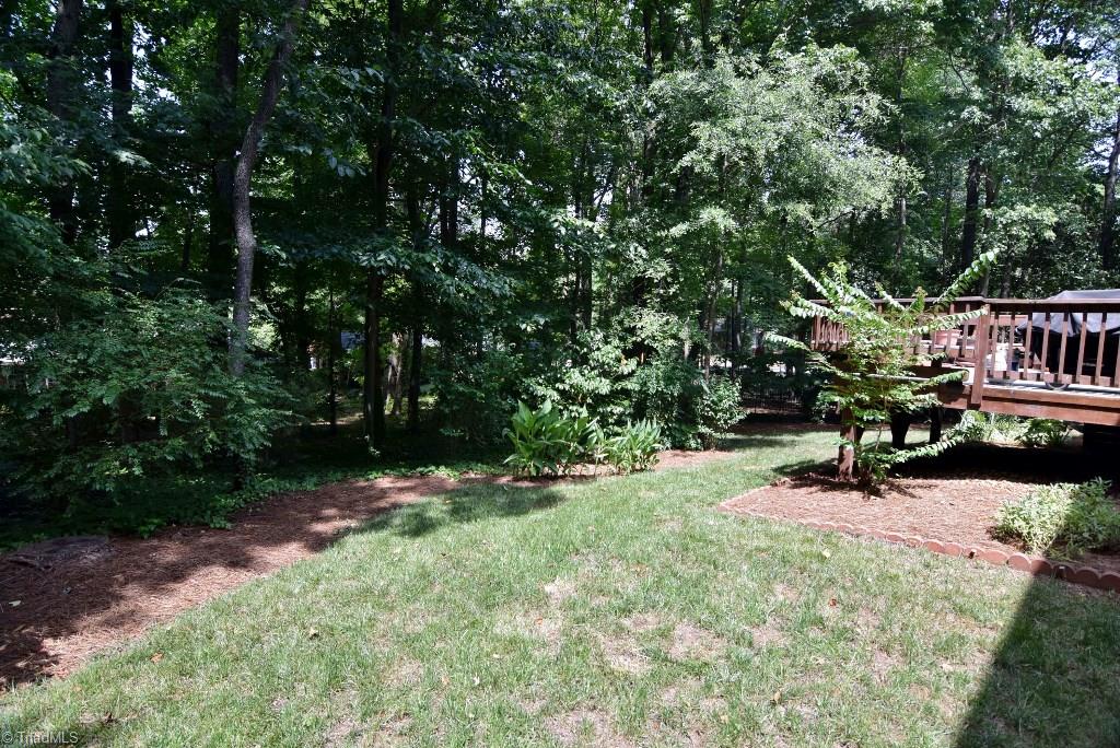 1902 Milan Road Greensboro, NC 27410 - Photo 30 of 30 Private, partially wooded backyard