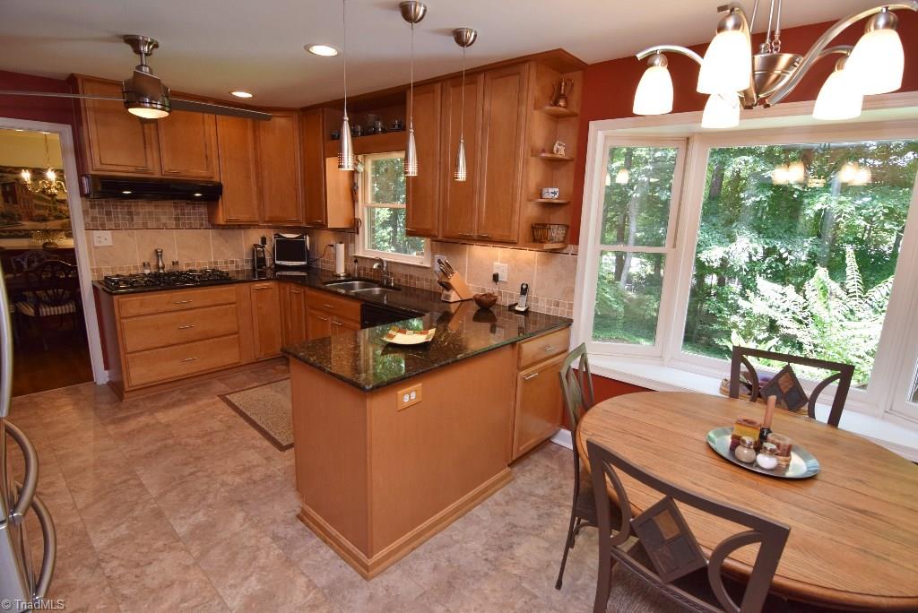 1902 Milan Road Greensboro, NC 27410 - Photo 6 of 30 New kitchen flooring. Updated lighting.