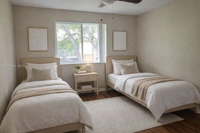 a bedroom with bed and a window